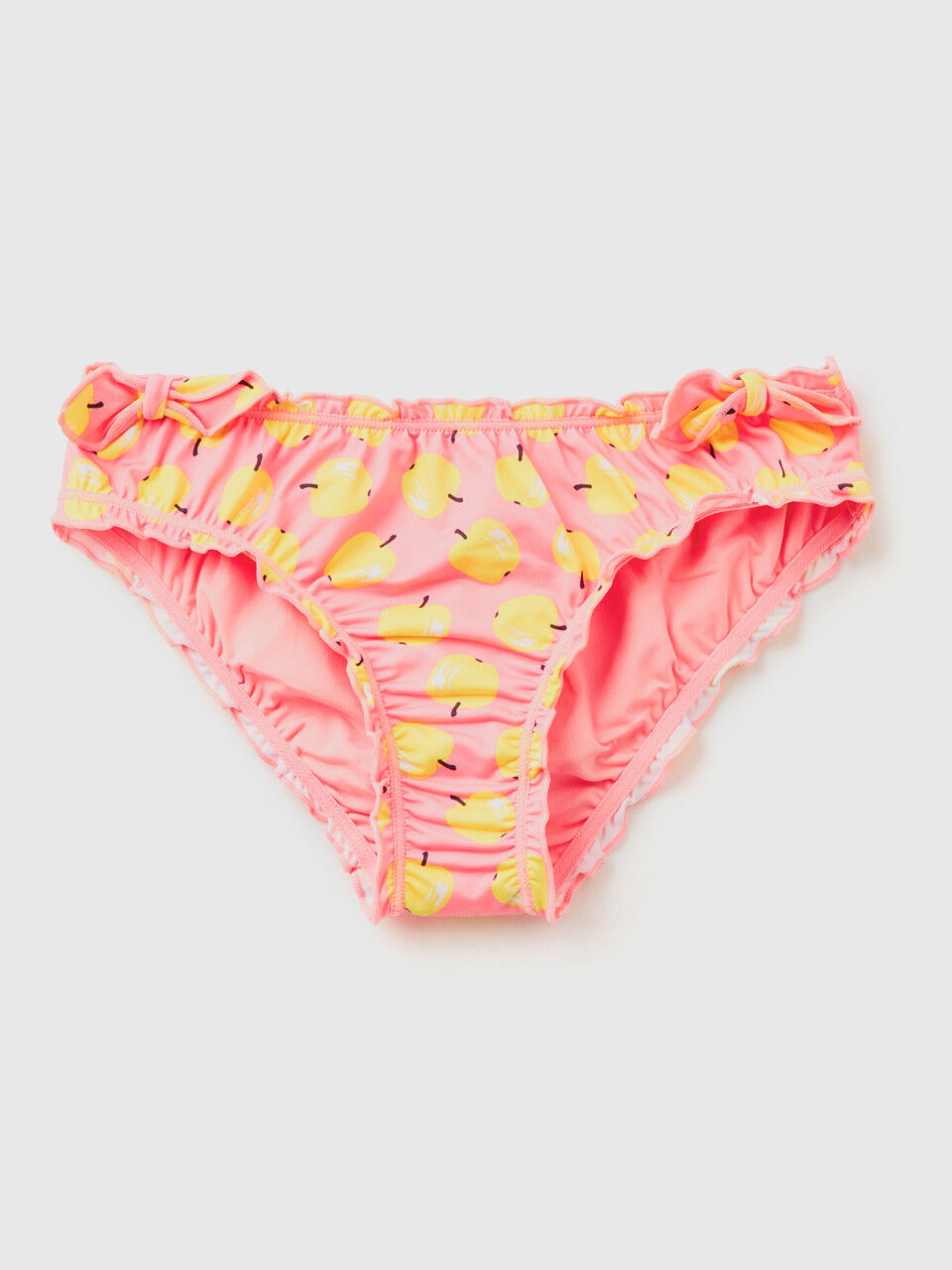 Pink swim bottoms with apple pattern