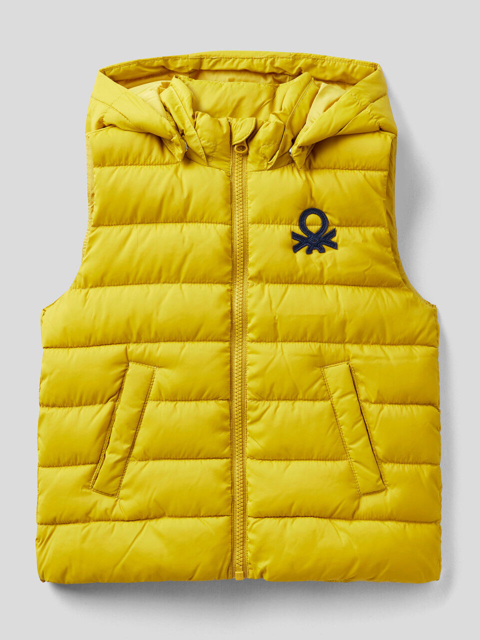 Padded vest with removable hood