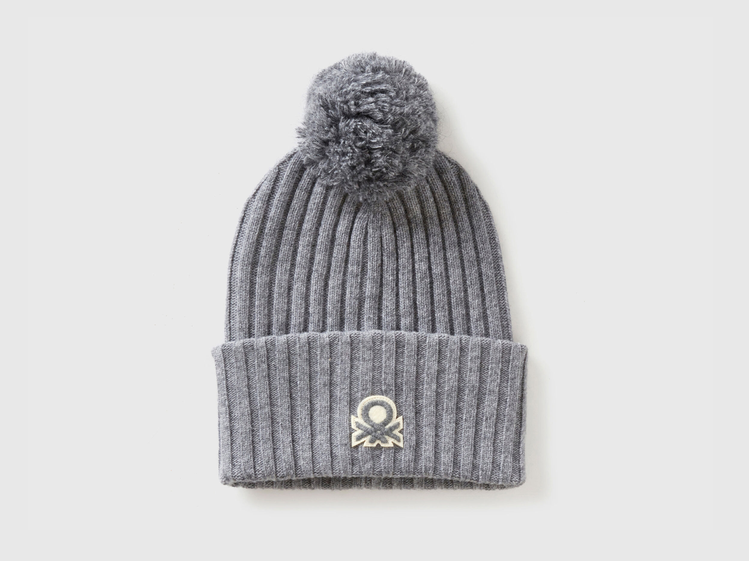 Hat with logo and pom pom